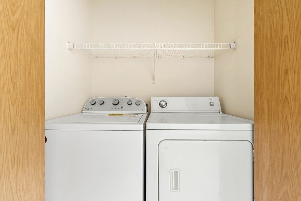 Laundry closet with washer and dryer